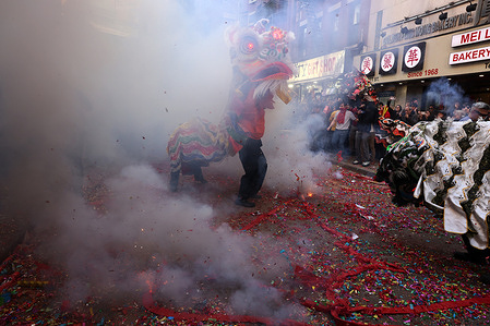The lions seen dancing around the firecrackers which ward of evil spirits. Super Saturday is the 'closing' of the Lunar New Year which has lasted 15 days. The lion dance troupes visit local businesses in Chinatown to offer blessings for prosperity, wealth, and success which is usually received by red envelopes (Hongbao) in return.