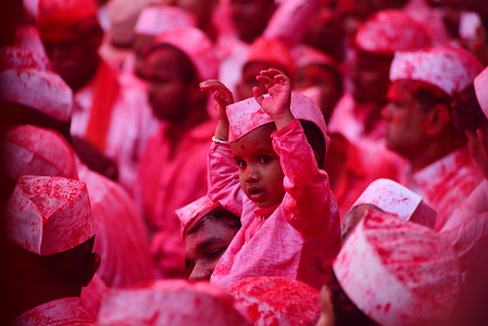 Pilgrims, covered in red powder (Gulal), dance to the tune of traditional drums near the temple ground. The Veer Maskoba Red Festival, or Shreenath Veer Mhaskoba festival, celebrates Lord Shiva's avatar, Shrinath Veer Mhaskoba. Pilgrims from nearby villages participate by carrying flags, dancing, and praying around the temple twice daily. The festival honors the divine marriage of Lord Mhaskoba and Mata Jogeshwari, with a striking use of red powder (gulal), creating a vibrant atmosphere. Devotees carry palanquins with the idols, accompanied by traditional music and saffron flags.