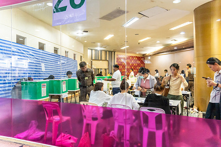 A view inside a polling station, with a police officer overseeing the process during Thailand’s advance voting ahead of the 2026 general election, at Imperial World Ladprao Shopping Mall, Wang Thong Lang District, Bangkok. Thai election advance voting is held one week before the general election, which in 2026 takes place on Sunday, 8 February, allowing registered voters to cast their ballots early if they cannot vote on election day.