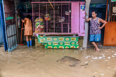 Super typhoon victims clean their houses after the raging wind and rain of Noru. Super Typhoon Noru locally named as Karding battered the landmass of Luzon island in the Philippines. Noru with winds of 140 kilometers per hour gusting to 170 km per hour forced the evacuation of thousands of individuals.