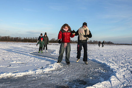 Skaters take to a cleared track after a snowfall and freezing temperatures on the frozen Ouse Washes Fen-skaters and those playing ice hockey make the most of the frozen flooded fields while they last. Fen-skaters and those playing ice hockey make the most of the frozen flooded fields while they last. The beauty of this natural skating is that it is very safe, with the ice on the flooded fields only 4 inches deep at its deepest. It may be years before the conditions are right again. They hope that if the winter is cold enough, a skating championship can be held (last held in 2009).