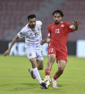 Hasan Srour (R) of Lebanon and Osama Anbar of Yemen seen in action during the Asian Cup Saudi Arabia 2027 Qualifiers match between Lebanon and Yemen at Grand Hamad Stadium Stadium. Final score Lebanon 0 : 2 Yemen.