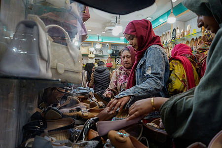 Muslims shop ahead of the Muslim festival Eid al-Fitr, which marks the end of the month of Ramadan, at a market in Srinagar. Markets across the Muslim world witness huge shopping rush in preparation for Eid al-Fitr, a celebration that marks the end of the Muslim fasting month of Ramadan.