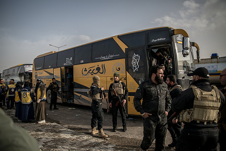 Buses transferred hundreds of people from Al Hol camp in Hasaka Governorate, northeast Syria, to Aq Burhan camp in Aleppo Governorate, northwest Syria. After Syrian government forces took control of Al Hol camp in Hasaka province on Jan. 21, 2026, authorities began evacuating the site. Tens of thousands of residents, mostly women and children with alleged ISIS links, are being moved to the Akhtarin camp in Aleppo province, while others are being repatriated. Officials also said more than 10,000 people escaped during the transition, as the government moves to close Al Hol and reassess detainees.