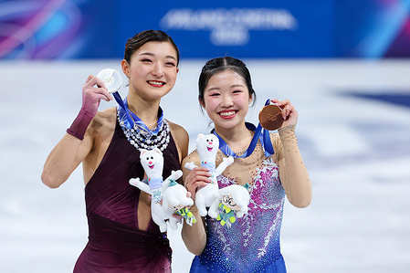 Silver medalist Kaori Sakamoto of Japan and Bronze medalist Ami Nakai seen during the Figure Skating Women Single Skating - Free Skating of the Milano Cortina 2026 Winter Olympics at Milano Ice Skating Arena.