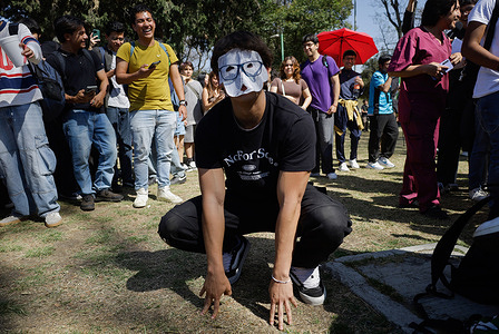 A young man who identifies as a Therian wears a mask at Las Islas (The Islands) at the National Autonomous University of Mexico (UNAM) to express his feeling of being an animal and "to experience a deep, psychological, or spiritual connection with an animal." According to the Therian subculture, their activities may include group dynamics, quadrobics (movement on all fours), the use of animal masks and accessories, and spaces for sharing experiences related to this identity.