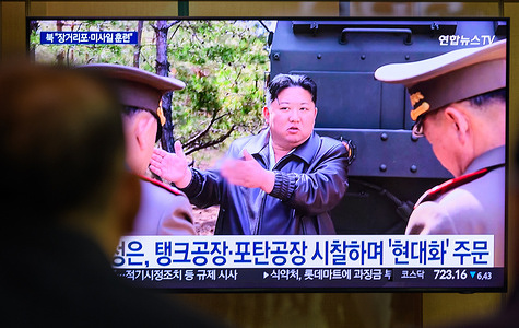 People watch a 24-hour Yonhap News TV broadcast on a large screen at Seoul Railway Station, showing North Korean leader Kim Jong Un inspecting a joint striking drill involving long-range artillery and missile systems of the Korean People's Army eastern front division, at an undisclosed location in North Korea. North Korean leader Kim Jong Un oversaw a joint striking drill involving long-range artillery and a new variant of tactical ballistic missiles, reaffirming the combat readiness of the country’s nuclear forces, state media KCNA reported on May 9. The exercise featured a 600mm multiple rocket launcher and the Hwasongpho-11-Ka tactical ballistic missile. South Korea’s military detected multiple short-range ballistic missile launches from Wonsan between 8:10 and 9:20 a.m. on May 8—North Korea’s fourth missile test of the year.