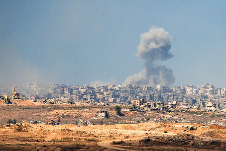 Gaza Strip as seen from the Israeli border, Smoke billowing from the ruins of Gaza City following Israeli airstrikes.