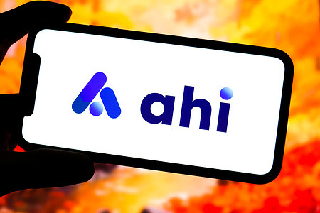 In this photo illustration, an Ahi logo is displayed on the screen of a smartphone.