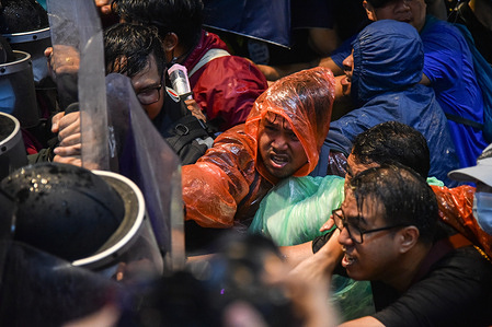 Pro-democracy protesters seen confronting the riot police during an anti-government demonstration.
Anti-government protesters attend a large demonstration at Pathumwan Intersection demanding the resignation of Thailand Prime Minister and the reform of the monarchy following a 'State Of Emergency' declared by Prime Minister Prayut Chan-o-cha. The demonstration ended with clashes with pro-democracy protesters and riot police.