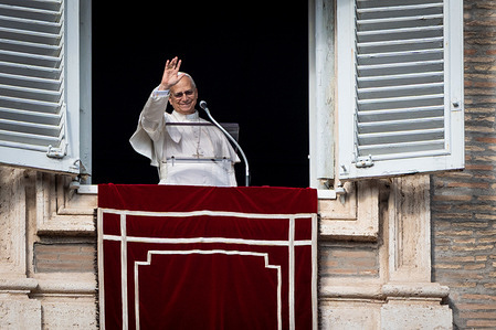 Pope Leo XIV greets the faithful after reciting the Angelus noon prayer from the window of his studio overlooking St. Peter's Square in Vatican.