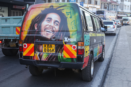 A graffiti portrait of the late Robert Nesta Marley a Jamaican singer, songwriter, and guitarist, painted on a matatu (mini bus) in Mombasa. Matatus are buses or mini-buses responsible for a big ​percentage of public transport in and around Nairobi. ​The public transport in Nairobi is so popular and unique​ because of the matutu culture. In Kenya’s capital, public transport is not just about getting from one place to another. It’s a culture, and you’ll start understanding why when faced with graffiti-covered buses. The graffiti often depicts celebrities, political figures,​ movies, and popular TV shows.
Several internationally famous politicians, boxers and musicians, including Cardi B​, Jay Z, Snoop Dogg, Chris Brown,​ among many others are featured on Nairobi matatus donning artwork with their images, praising the talent and culture.