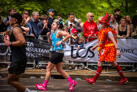 An athlete dressed in a costume competes during The TCS London Marathon.