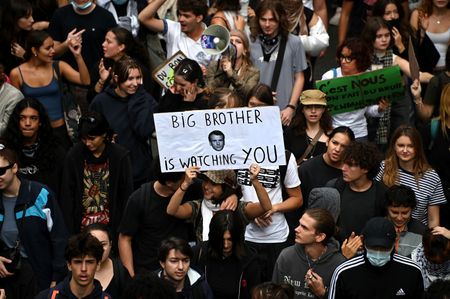 A protester seen holding a placard reading "Big brother is watching you" illustrated with a photo of President Macron. Thousands of high school students marched through the streets of Marseille, protesting government budget cuts and severe resource shortages across the national education system. Joining nationwide demonstrations and school blockades, the young protesters demanded increased funding to address overcrowded classrooms, dilapidated facilities, and acute teacher shortages.
