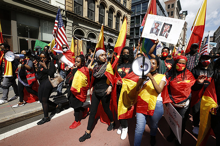 Demonstrators march in the streets draped in Tigray flags and chanting slogans during the demonstration. 
Demonstrators take to the streets in demonstration against the Eritrean military occupation of Tigray following the Ethiopian government ban of entry of journalists and aid workers to its State of Tigray and allegations of a humanitarian crisis and genocide. The government further denies Tigrayen deaths as well as the presence of the military from nearby Eritrea in the region.