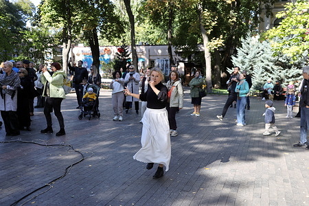 A woman dances during a performance by musicians in the City Garden. A concert dedicated to the Education Workers' Day was held in the City Park. The purpose of these events is to support the morale of the population in the face of ongoing military aggression by the Russian Federation.
Education Workers' Day or Teacher's Day is a professional holiday for education workers. It is celebrated annually on the first Sunday of October. World Teachers' Day is celebrated on October 5.