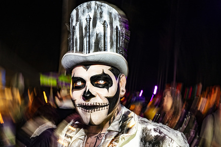 Participants in the Dia de los Muertos (Day of the Dead) celebration at the Hollywood Forever Cemetery in Los Angeles, California. Day of the Dead has its origin in Mexico and is widely celebrated by Mexican Americans as a tribute to the lives of loved ones who passed away.