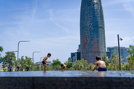 Children are seen playing with water under the sun in a public park in the Glories neighborhood. With temperatures rising above 30 degrees celsius, summer has officially arrived in the spanish city.