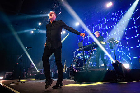Andy McCluskey (C) and Paul Humphreys (R) of English band Orchestral Manoeuvres in the Dark (OMD) perform a sold out show at History in Toronto.