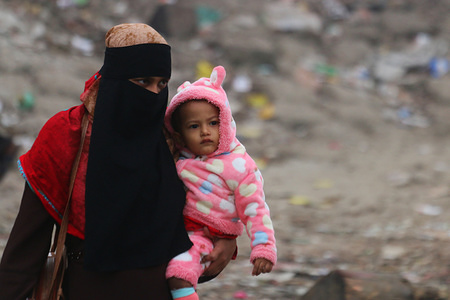 A mother and child walk on the street during a cold wave in Dhaka.
The country’s lowest temperature on Thursday were recorded at 7.9 degrees Celsius in Chuadanga, according to the Met Office. At the same time the lowest temperature in Dhaka were recorded at 13.2 degrees Celsius.