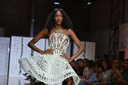 A model showcases creations by Señorito Ortega during the Atelier Couture bridal catwalk within Madrid Fashion Week, at Fabrica de Tapices in Madrid.