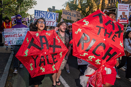 Hundreds take to the streets to march on May Day. Yale university students protest and march on May Day.