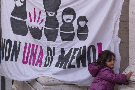 A child seen playing in front of a large banner during the protest.
The feminist movement "Non una di Meno" of Rome take to the streets to defend feminist spaces in the city of Rome because of eviction risk of women's home including "La Casa delle donne Lucha y Siesta", "Casa Internazionale delle Donne", "Centro donna L.I.S.A." and "Centro donne DALIA" and other feminist spaces.