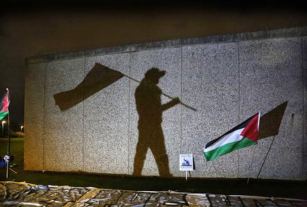 A giant shadow of a protester holding a flag is projected onto the ten-foot prison walls during the demonstration. Supporters of the Filton 24 rallied outside HMP Peterborough in solidarity with the pro-Palestine activists on remand, including the six currently on hunger strike across UK prisons. The group has been detained for at least a year after being arrested for targeting Elbit Systems’ Filton site in Bristol and destroying quadcopter drones they said were destined for use in Gaza. The hunger-striking prisoners are calling on the government to end censorship and surveillance of their communications, grant immediate bail, ensure a fair trial, de-proscribe Palestine Action, and shut down Elbit Systems. More prisoners are expected to join the hunger strike soon.