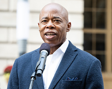 New York City Mayor Eric Adams (D) speaking at a flag raising for the Suriname flag in Bowling Green Park in New York City.