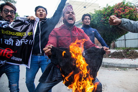 KATHMANDU, NEPAL - MAY 11, 2020:
Students burn an effigy of Indian Prime Minister Narendra Modi during the protest amid Coronavirus (COVID-19) lockdown crisis.
Police detained students who came to burn an effigy of Indian prime minister Narendra Modi on the streets of Kathmandu protesting against the recent announcement of the Indian government to open the link road to Mansarovar that passes through an area disputed between Nepal and India.