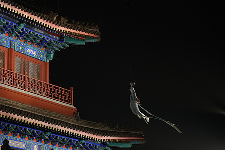 A dancer performs the dance of the goddess scattering flowers during the Mid-Autumn Festival celebration. The event was held to celebrate the upcoming Mid-Autumn Festival.