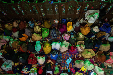 Kashmiri Muslim women offer prayers inside the shrine during the Shab-e Barat occasion at Charar-e-Shareef area in Budgam district, south-west of Srinagar.