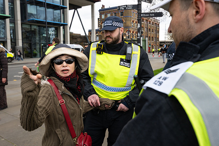 A protestor is arrested after an altercation with the police during a demonstration. Demonstrators gather for the annual Al-Quds Day protest during a static rally along the River Thames after a planned march was banned by authorities amid concerns over public disorder. Large numbers of police officers were deployed across central London to monitor the demonstration and nearby counter protest. The rally, traditionally held in support of Palestinians and opposition to Israel, is organised by the Islamic Human Rights Commission and takes place during the final days of Ramadan to mark Al-Quds Day.