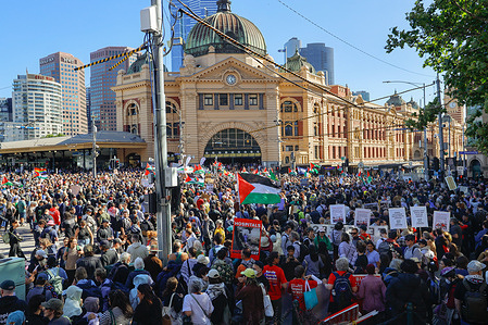 A crowd of protesters gathers outside Flinders Street Station before the demonstration march through Melbourne's CBD. Thousands of pro-Palestinian supporters gathered in Melbourne to protest the visit of Israeli President Isaac Herzog, who is in Australia from February 8–12 for official engagements and meetings with the Jewish community. Herzog has visited Sydney and Canberra and arrived in Melbourne today as part of his trip. The demonstrations reflect opposition to Israel’s actions in Gaza and criticism of the Australian government’s decision to host the Israeli president.