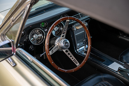 The steering wheel and interior of a 1968 Ford Mustang on show in the paddock during the 2026 Shere Hill Climb on Staple Lane in Shere. The annual Shere Hill Climb returned to Staple Lane in the Surrey Hills, bringing together more than 200 cars and motorcycles ranging from historic classics and exotic vehicles to more unusual and everyday models. First held in September 2013, the event had grown into an established fixture on the motoring calendar, attracting drivers, owners and enthusiasts. Alongside the hill climb, visitors enjoyed an open paddock, motoring displays, stalls and family entertainment, with proceeds supporting local charities.