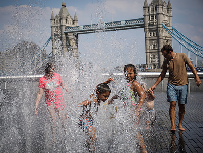 Kids seen playing at a water fountain and cooling down on a hot day.
High temperatures in the United Kingdom will continue and the temperatures will be 35 degrees Celsius according to the Met Office.