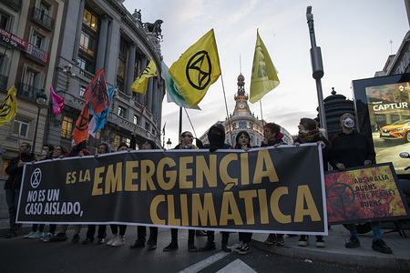 Protesters blocked Alcala Street while holding Extinction Rebellion Flags and a banner during the demonstration.
Climate change activists from Extinction Rebellion are calling on Australian politicians to do more to protect citizens and wildlife from the ongoing bushfire crisis, as well as demanding action from leaders worldwide to prevent climate change.