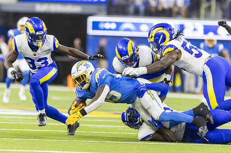 Los Angeles Chargers safety Jaylen Jones #35 is brought down the Los Angeles Rams during an NFL preseason football game at SoFi Stadium, in Inglewood, Calif.