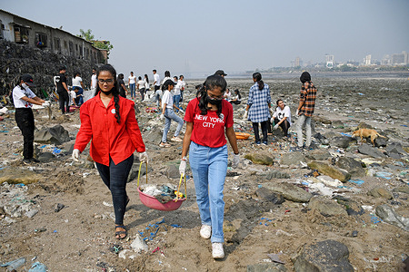Volunteers clean garbage at Mahim creek in Mumbai. Garbage clean up drive was organized on the occasion of Earth Day to create awareness about the environment.