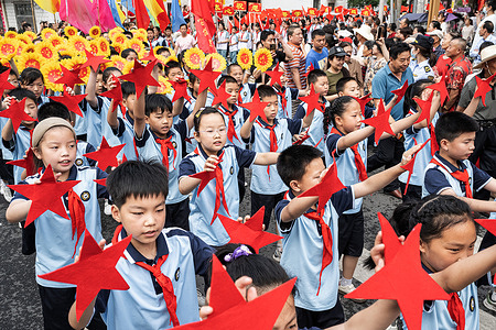 Children from a local primary school seen holding pentagram and sunflower props on the street to bid farewell to students off for the annual College Entrance Examination. Students spend months preparing for the annual examination and the results determine students' educational path and future job prospects. A total of 13.35 million students are expected to take the tests over three days.