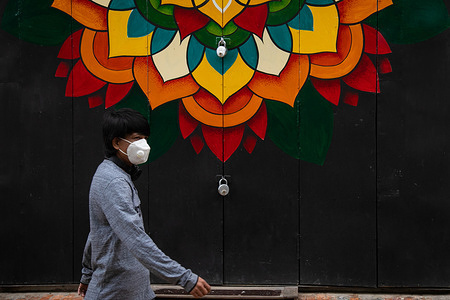 A man wearing a face mask walks past a closed shop during the coronavirus pandemic.
Nepal is in the second lockdown since 20th Aug as a preventative measure against the rapid spread of Covid-19. After the first national wide lockdown lift, it has seen a rapid increase in the coronavirus cases. Nepal reports 164 Covid-19 deaths as infection tally hits 33533.