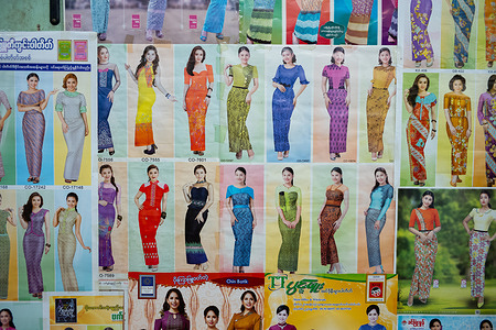Posters display various colors of Htamain, the traditional wrap-around skirt worn by Burmese women, at Zay Cho Market, the biggest and oldest wholesale and retail market in Mandalay, which serves as the city’s primary commercial hub and a key distribution point for goods coming from upper Myanmar as well as neighboring China, India, and Thailand.