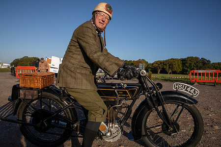 A member of the Sunbeam Motorcycle Club seen wearing traditional riding clothing sets off on the annual Pioneer Run. The Sunbeam Motorcycle Club held its annual Pioneer Run. The event began at Tattenham Corner and ended at Brighton City Airport. It featured veteran motorcycles and three-wheelers built before 1915.