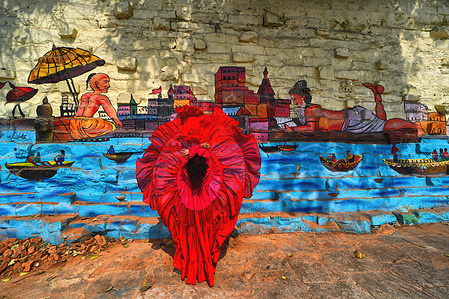 A model (Rohini) poses for a documentary fashion shoot at Bundiparkota Ghat. The Project documents the popular travel destination initiative designed for local tourists during the summer season organised by Creative Art Solution, a registered Photography Club of India. The city also known as Benares or Kashi is the oldest continuously inhabited city and one of the holiest Hindu cities.