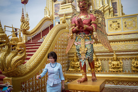 A Thai woman pose for a picture at the Royal Crematorium site during the opening ceremony visit one day before the general opening for public.
The Royal Crematorium site will be open for the public during one month before they dismantled it as Thailand spent $90 million of US dollars to build the Royal Crematorium and prepare the Royal funeral for the late Thai King Bhumibol Adulyadej (Rama IX). Thailand's Late King Bhumibol Adulyadej was the world's longest serving monarch who died on October 13th, 2016 at Siriraj Hospital in Bangkok. The Royal funeral ceremony taking place over three days in the Thai Capital front of the Royal Palace at the Grand Royal Crematorium site exclusively build for the much beloved King Rama 9. Today the Royal Relics and Ashes were transferred back to the Grand Palace and will be transferred into two different Temples in Bangkok on Sunday.