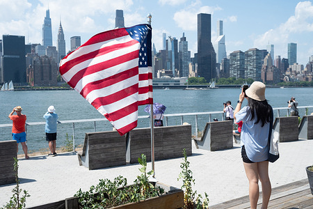 People watch Sailboats on the first day of Sail4th 250 celebration in the Queens borough of New York City.