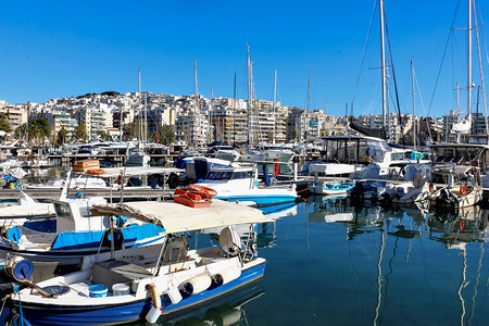 A panaromic view of the Pasalimani port in Piraeus, we meet fishermen in their boats working with their fishing nets.