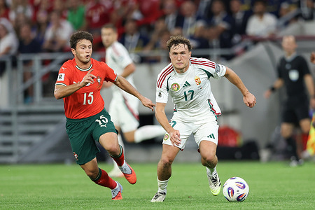 Joao Neves of Portugal (L) and Callum Styles of Hungary (R) seen in action during European World Cup Qualifiers 2026 football match between Hungary and Portugal at Puskas Arena. Final score; Hungary 2 : 3 Portugal.