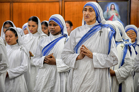 Christian Nuns offer their love and prayers on the eve of Mother Teresa's 112th birthday at Missionaries of Charity in Kolkata. Mother Teresa, known in the Catholic Church as Saint Teresa of Calcutta, devoted her life to caring for the sick and poor lives throughout the world & canonised by the Roman Catholic Church as Saint Teresa.
