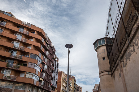 Exterior view of the Model of Barcelona Prison practically in connection with the buildings of the city. After 113 years in service, the Barcelona's Modelo Prison ceased its activity in June of 2017. In the middle of the urban fabric of the city has been constant neighborhood activity to achieve its decommissioning. Today, finally, the Mayor of Barcelona, Ada Colau, has delivered symbolically the penitentiary centre to the city of Barcelona. Starting today, and as far as the presentation of urban redevelopment projects the centre can be visited by citizens.